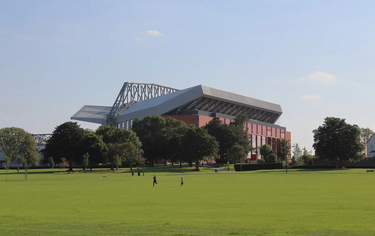 Anfield stadium seen across the grass of Stanley Park